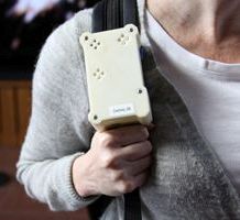 The Citisense device carried on the strap of a user's backpack