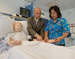Northumbria University lecturer Dr John Unsworth and nursing student Viliporn Runkawatt undertaking blood pressure checks on a SIM patient