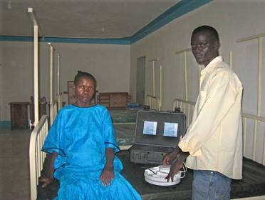 Chadiga Nelson, Healthcare Assistant with the handheld ultrasound system 
in the Martha Primary Healthcare Centre’s new paediatric ward.